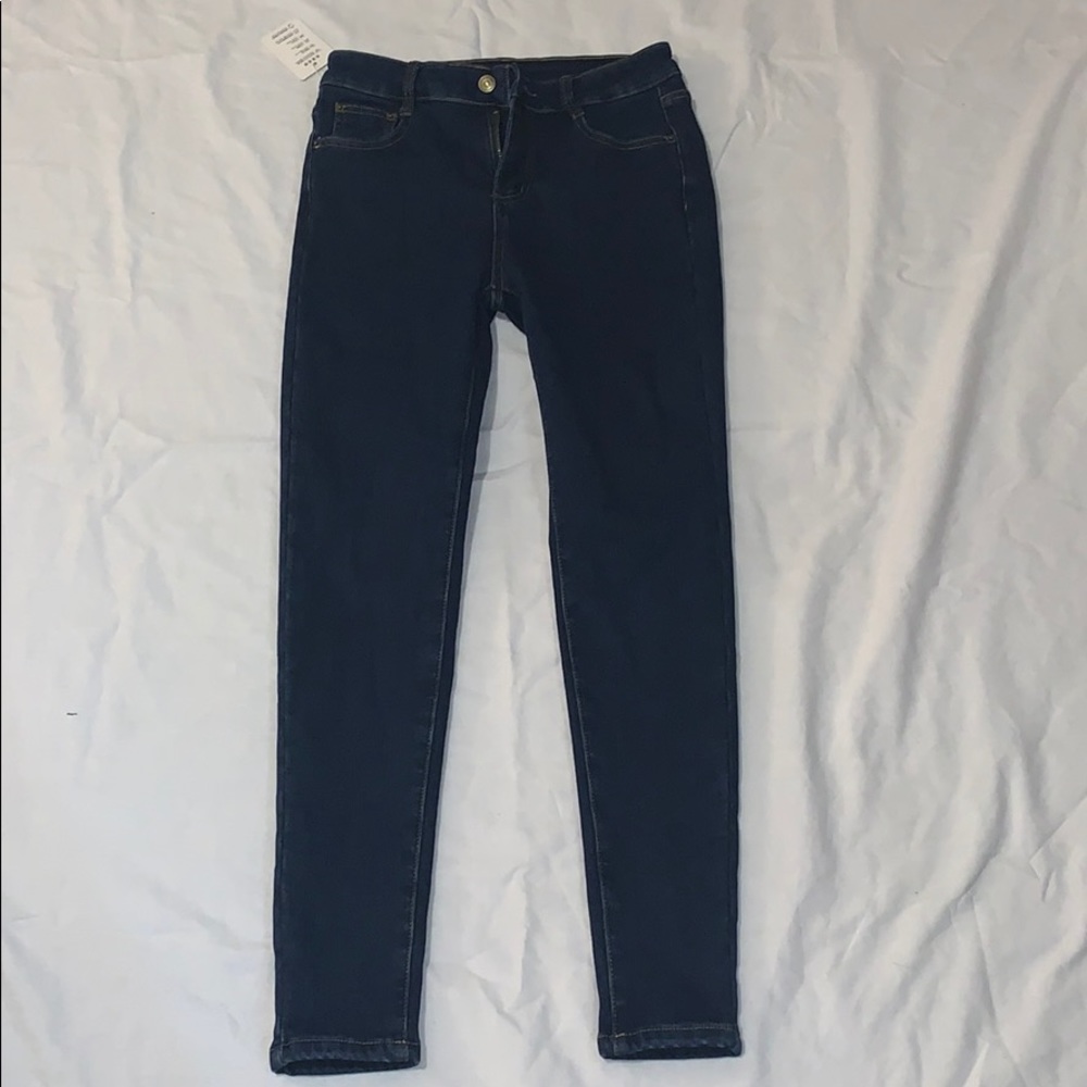 Blue skinny legged jeans